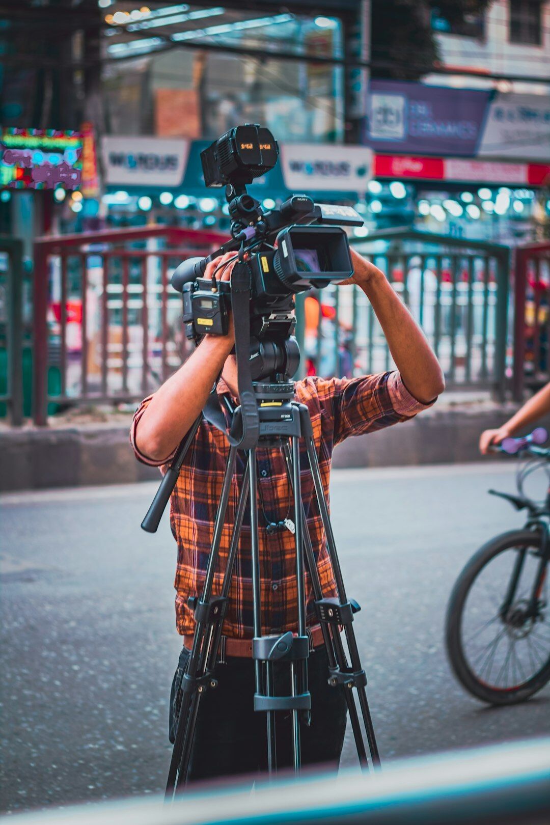 Camera operator filming in a television studio
